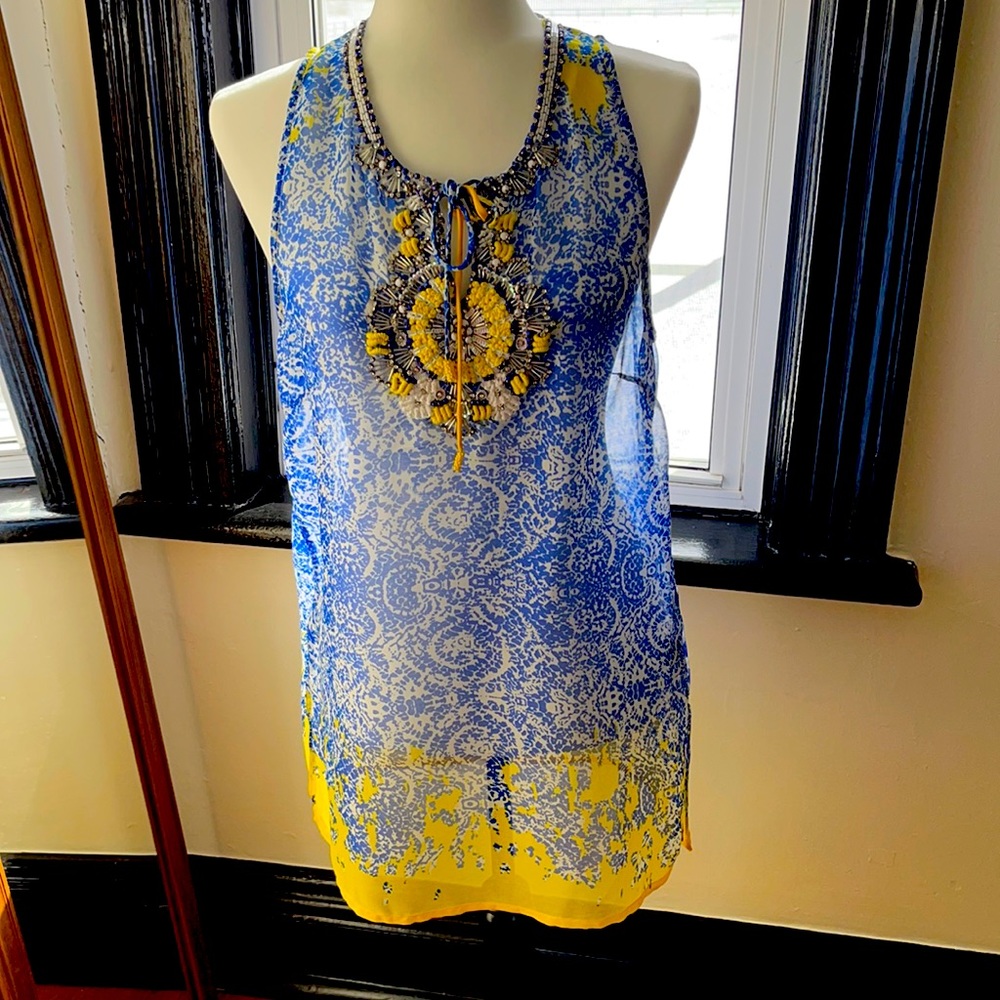 Gorgeous sleeveless tunic for day or evening. Like new. Never worn. Very chic